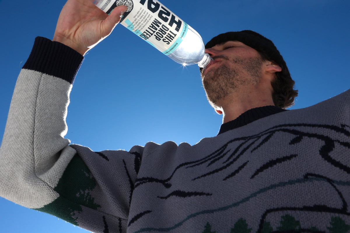 Person holding an H2ALL bottle