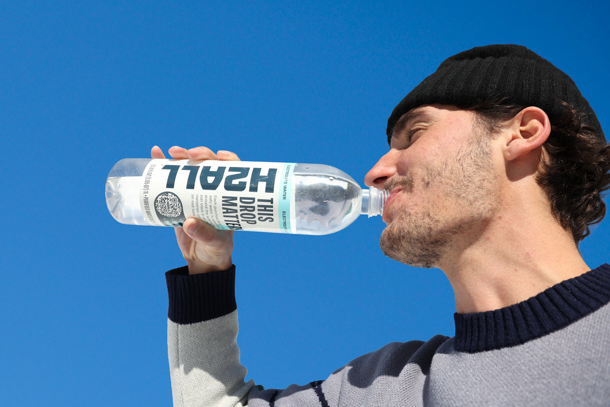 Person holding an H2ALL bottle